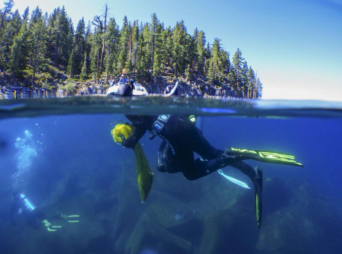 Divers haul up litter found on the bottom of Lake Tahoe. From now through the fall, volunteers will conduct coordinated underwater trash pickups along all 72 miles of the lake's shoreline.
