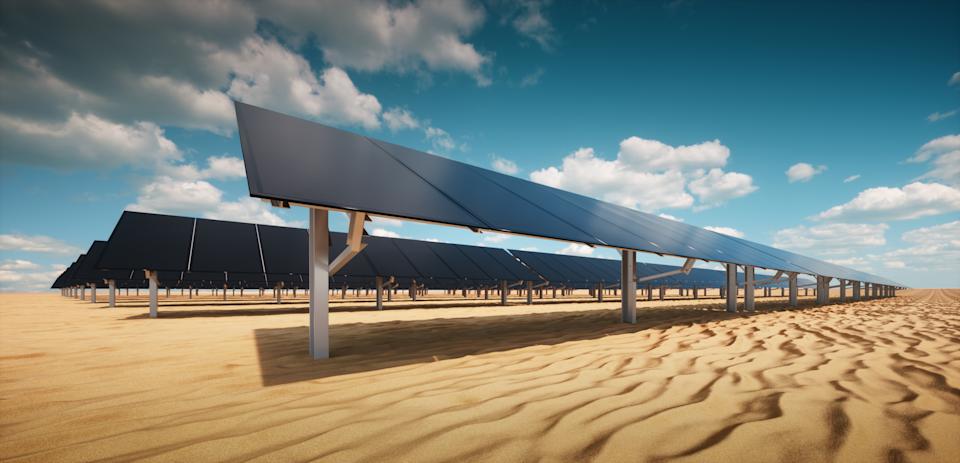 Modern black solar panel of a photovoltaic power plant in a desert environment in sunny weather. 3d rendering.