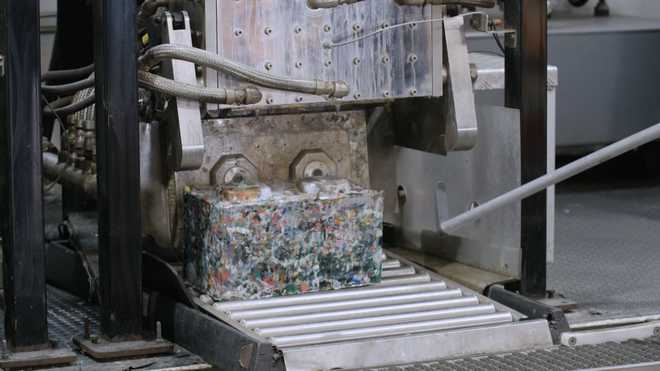 ByFusion's Blocker System shreds plastic waste and compresses it in minutes into blocks.