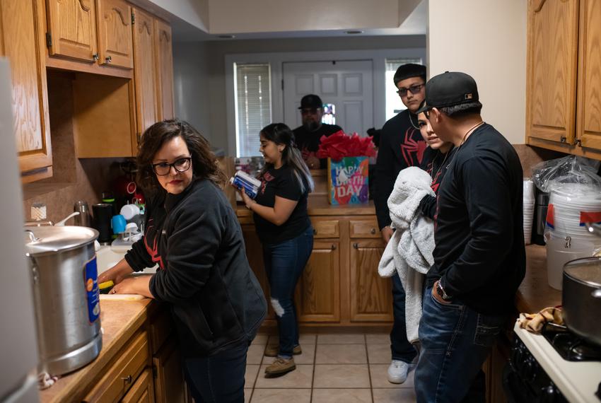 Elvia Guevara (left) washes dishes before her grandson’s Spiderman-themed 1st birthday party on February 11, 2023 in Pasadena, Texas. Her family moved to Deer Park in 2008. “We always wanted to live here,” she said, “because the school districts are good and it’s safe and clean.”